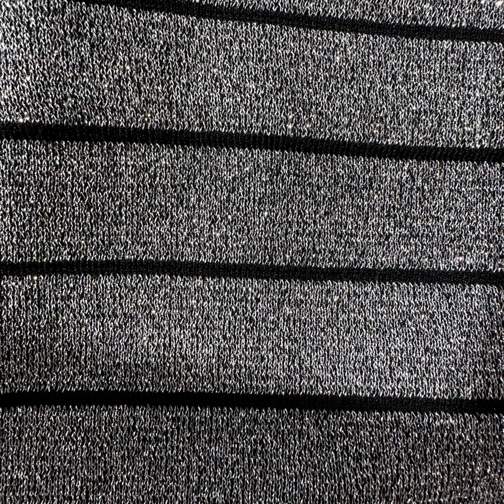 Black and silver lurex skirt knee length , knitted style very fitted .
